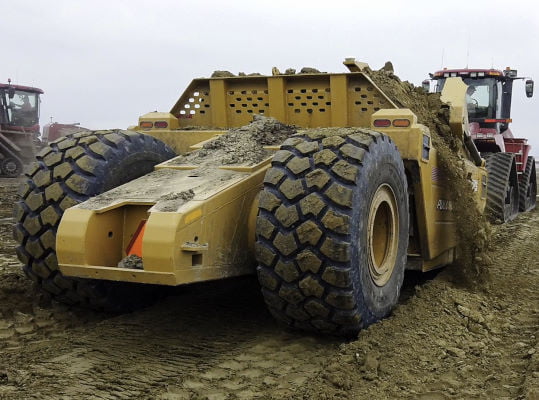 Bridgeview - Pulldozer 1220A scraper pan loading